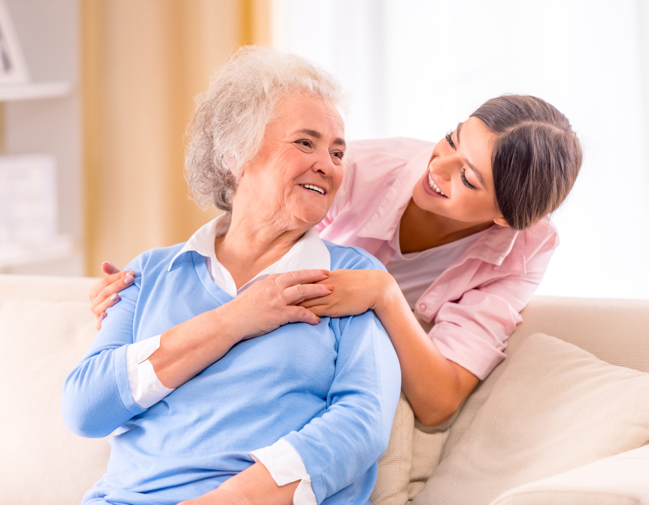 Caregiver helping a senior client return home from the hospital